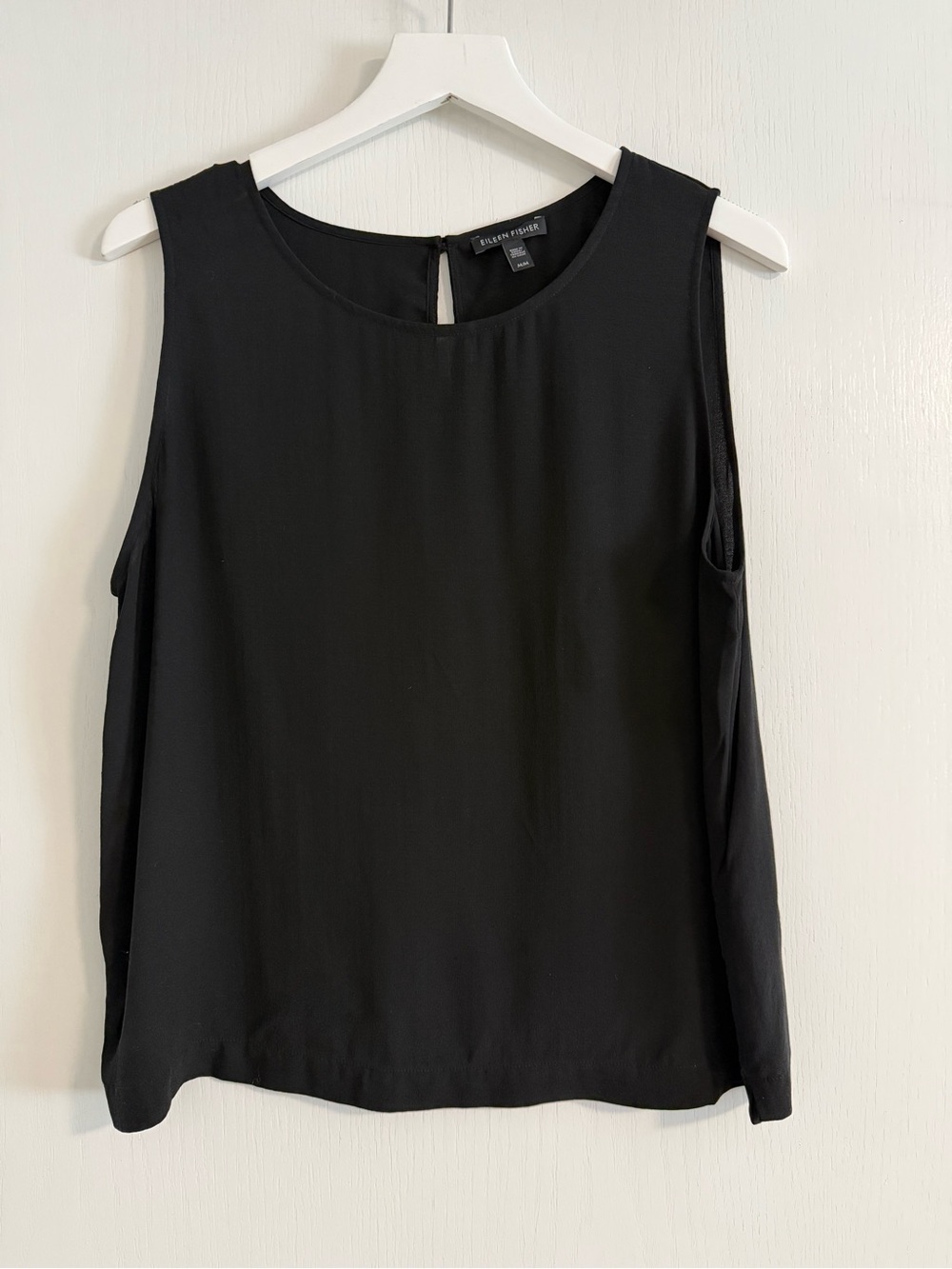 Eileen Fisher women’s sleeveless black top with button opening in back size M